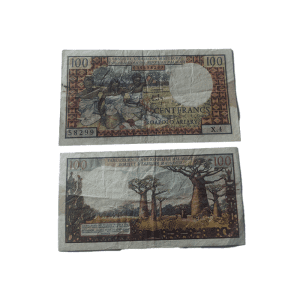 1964 Madagascar 20 Ariary / 100 Francs banknote featuring a Malagasy woman with a basket on the front and a rural village scene on the back, issued by Institut d’Émission Malgache